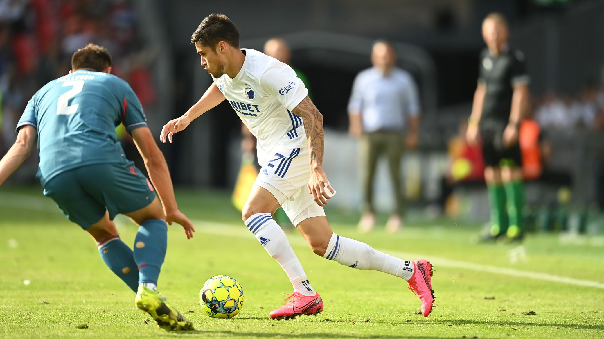 Kevin Diks making a crucial tackle during a Bundesliga match